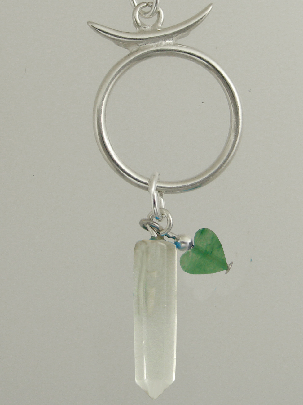 Sterling Silver Taurus Pendant Necklace With an Clear Crystal And Green Heart